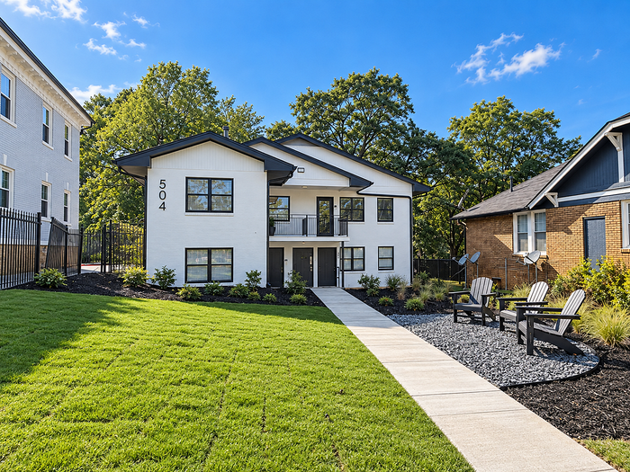 Recently renovated quadplex. Updated landscaping with seating.