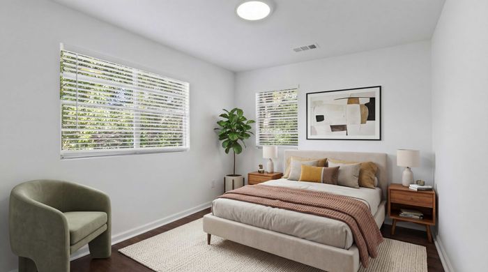 Bright and cozy bedroom with modern decor, featuring a plush bed, stylish nightstands, and abundant natural light through large windows.