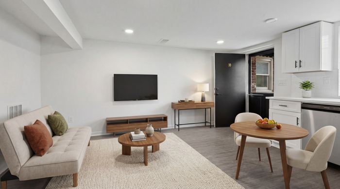 Modern living space with stylish decor, cozy sofa, and elegant dining set, ideal for comfort and functionality.
