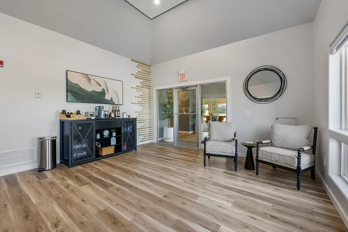 Chic lobby area with modern seating, stylish decor, and warm wood flooring for a welcoming atmosphere.