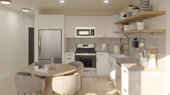 Modern kitchen with sleek white cabinets, stainless steel appliances, and elegant open shelving enhanced by natural light.