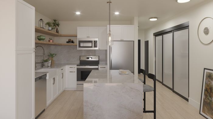 Modern kitchen with sleek white cabinetry, marble countertops, and a stainless steel oven and refrigerator, accented by stylish open shelves and elegant pendant lighting.