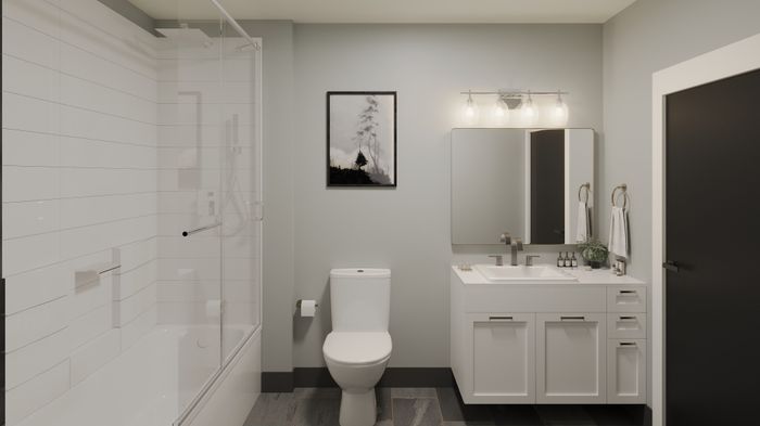 Modern bathroom with a sleek shower, elegant vanity, and contemporary decor.