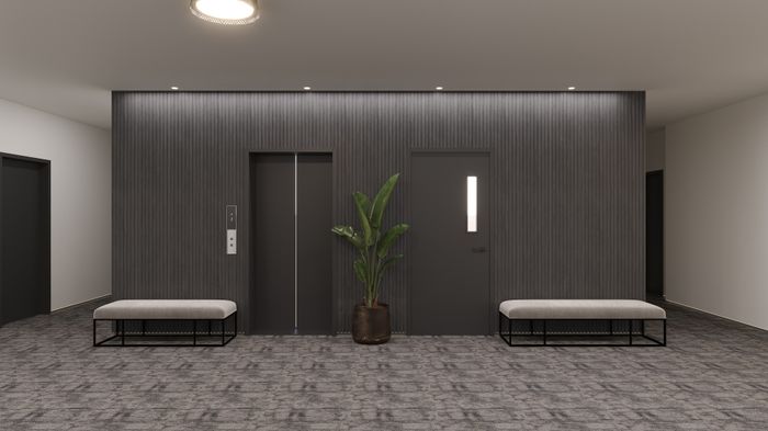 Sleek modern hallway with stylish elevator, elegant benches, and vibrant potted plant creating a welcoming ambiance.