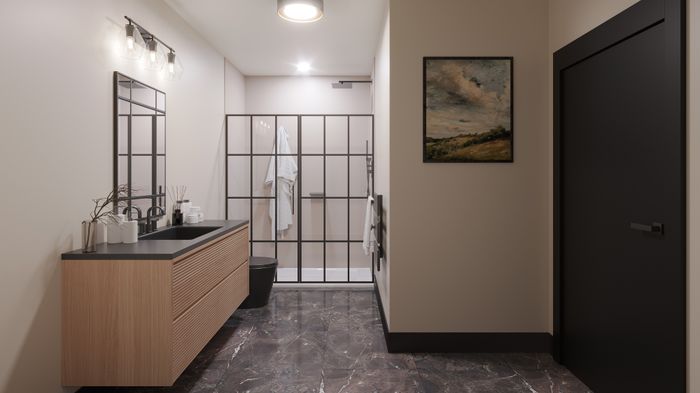 Modern bathroom with elegant wood vanity, glass shower enclosure, and stylish decor, featuring warm lighting and chic artwork.