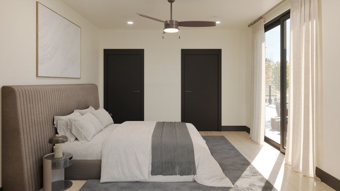 Serene and modern bedroom with plush bedding, sleek ceiling fan, and private terrace access through large sliding glass doors.