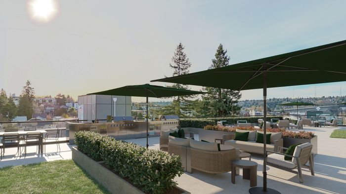 Luxurious outdoor terrace with modern patio furniture, shaded seating areas, and stunning city views under a clear sky.