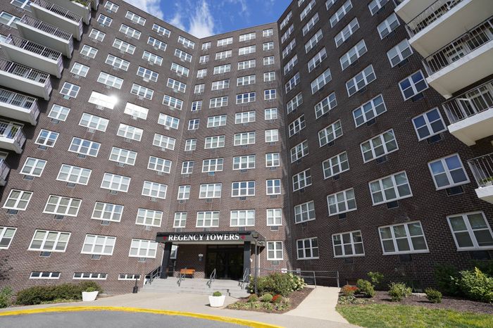 3-Bedroom Apartments in Allentown, PA - Regency Towers - View of Building Exterior with Grass, Bushes, Staircase, and Wheelchair Access Ramp.