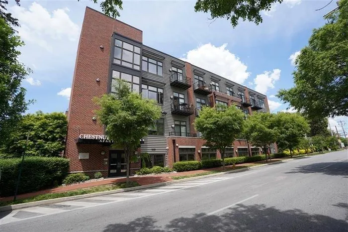 Apartments for Rent in West Chester, PA - Chestnut Street Lofts - Apartment Complex with Brick, Windows, and Private Balconies/Patios