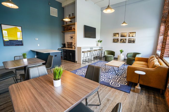 Apartments for Rent in Allentown, PA - The Mill - Community Room Equipped with a Small Kitchen, Comfortable Seating Throughout, and a TV
