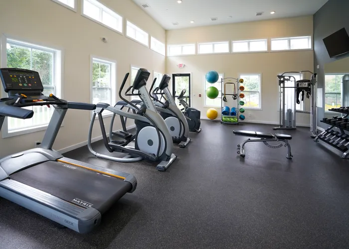 3 BR Apartments in Williamsport PA - Lakeview - Gym with Treadmills, Machines, and Equipment, with Window, TV, and Large Mirror