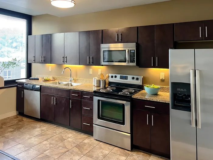 Apartments for Rent in Pittsburgh, PA - Apartments at River View - Kitchen Stainless-Steel Appliances, Dark Cabinets, and Tile Floors