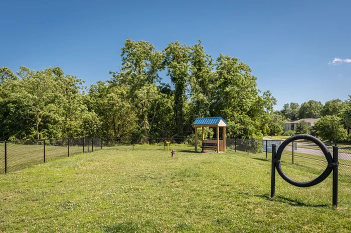 Outdoor dog park with obstacles at Apartments at Bel Air.