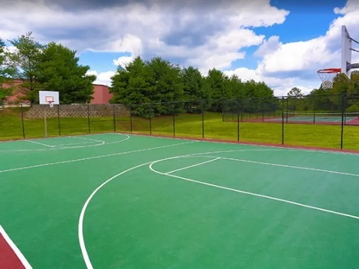 Basketball and tennis court at Apartments at Bel Air in Bel Air, MD.