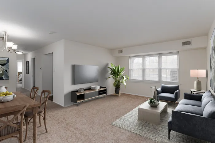 1 BR Apartments in Boothwyn, PA - Willowbrook - Furnished Bedroom with Carpeted Floor, Bed, Wooden Nightstand and Dresser, Windows and Decor.