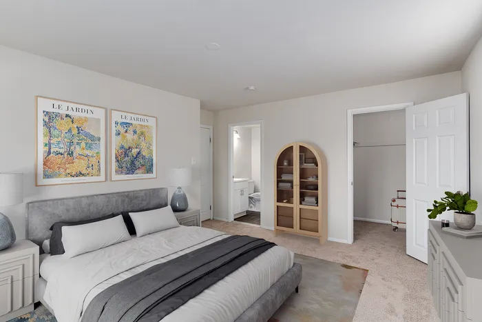 1 BR Apartments in Boothwyn, PA - Willowbrook - Furnished Bedroom with Carpeted Floor, Bed, Wooden Nightstand and Dresser, Windows and Decor.