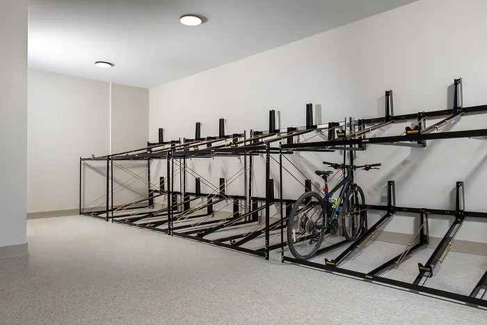 Contemporary indoor bike storage space with sleek metal racks.