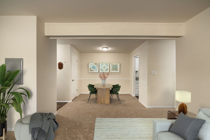 Inviting apartment interior with a stylish living room, cozy dining area, and modern decor.
