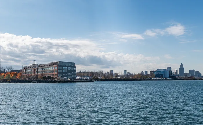 Charming waterfront building with picturesque city skyline views