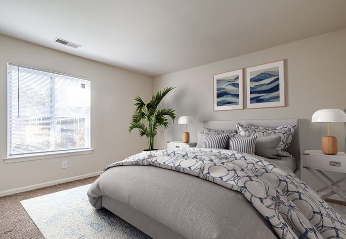 Elegant bedroom with large window, modern decor, and cozy bed featuring ocean-themed artwork and lush potted plant.