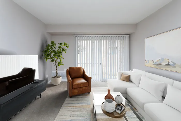 Modern living room at Apartments at Bel Air, with a sectional sofa and entertainment unit.