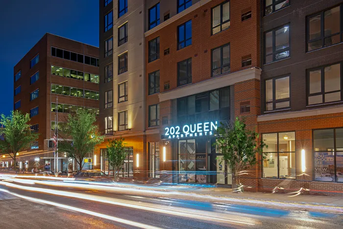 Chic urban living at 202 Queen Apartments with modern architecture and vibrant city life.