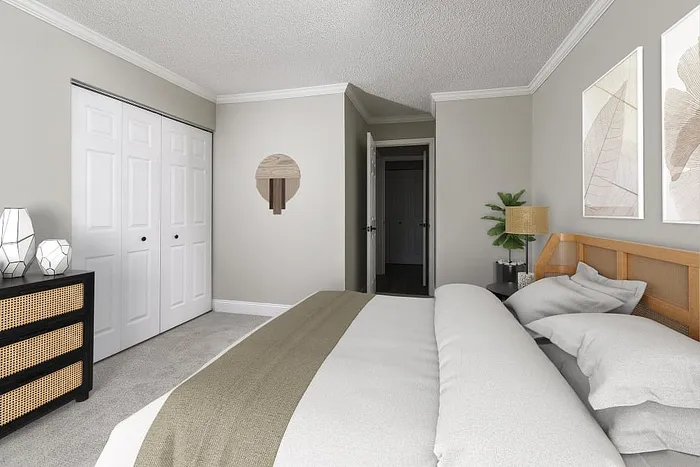 Charming bedroom featuring a cozy king-size bed, elegant d&eacute;cor, and ample closet space, perfect for a serene retreat.