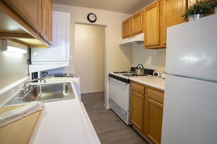 Charming kitchen with modern appliances, wooden cabinetry, and a cozy layout perfect for culinary creativity.