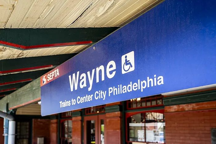 Inviting Wayne station sign, a gateway to Philadelphia's vibrant Center City via SEPTA.