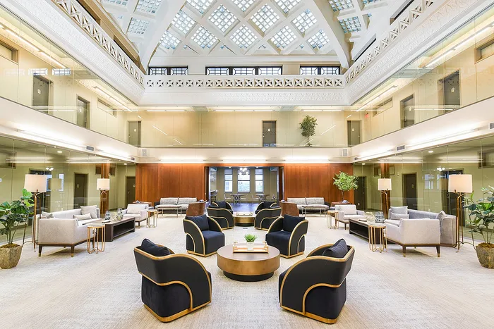 Luxurious atrium lounge with elegant seating and stunning architectural details, perfect for stylish living.