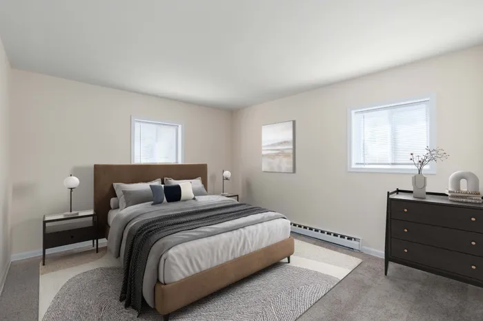 Elegant bedroom with a plush king-sized bed, modern decor, and cozy ambiance.
