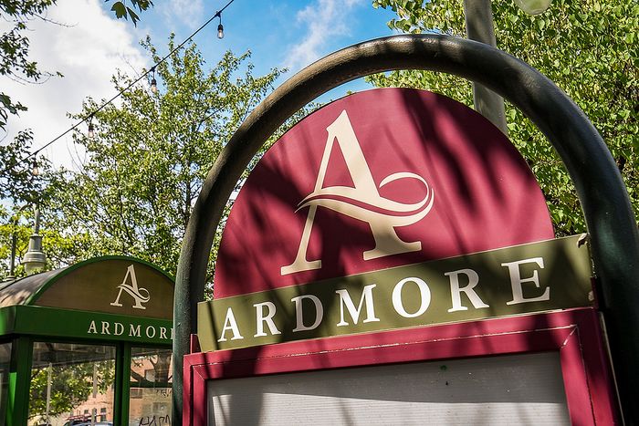 Inviting entrance sign for Ardmore Apartments set against a lush green backdrop, featuring elegant typography and a stylish design.