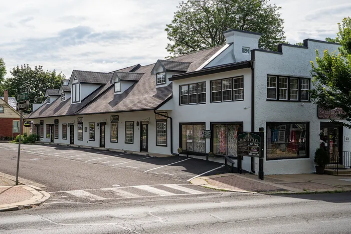 Charming commercial building with vintage architecture and inviting storefronts, perfect for boutique businesses.