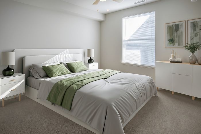 Bright and modern bedroom with elegant design, featuring a plush bed with green accents, stylish side tables, and soft natural light streaming through the large window.