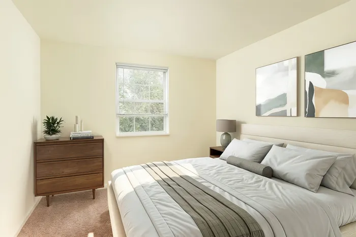 Inviting bedroom with soft beige tones, plush bedding, and elegant decor creating a tranquil retreat.