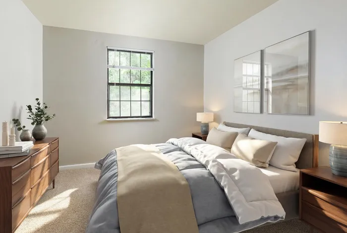 Bright and inviting bedroom with a large window, stylish wooden furniture, cozy bedding, and warm lighting, creating a tranquil retreat.
