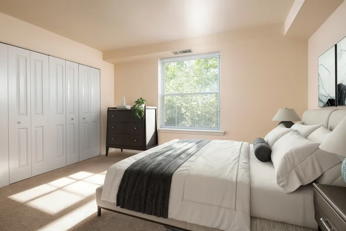 Bright, serene bedroom featuring a cozy queen-sized bed, large window with natural light, and elegant contemporary decor.