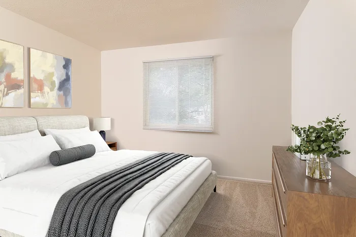 Elegant bedroom showcasing a plush bed with crisp white linens, modern decor, and a sunlit window, creating a serene and inviting atmosphere.
