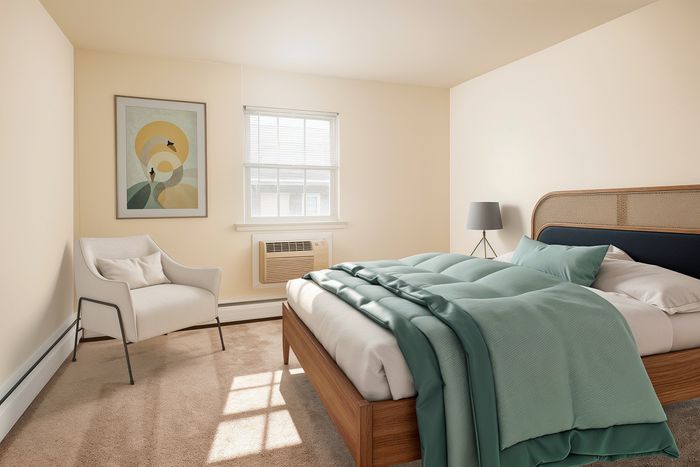 Inviting bedroom with a plush bed, elegant armchair, stylish floor lamp, and modern art on the wall, bathed in natural light.
