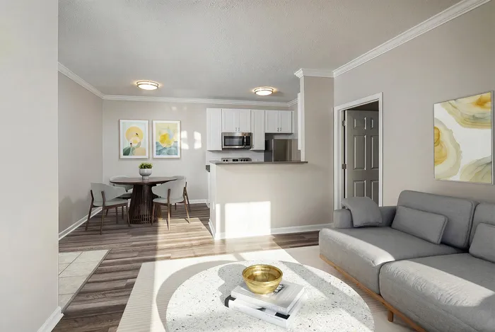 Bright and modern living area featuring an open-concept layout, stylish kitchen, and cozy dining space.