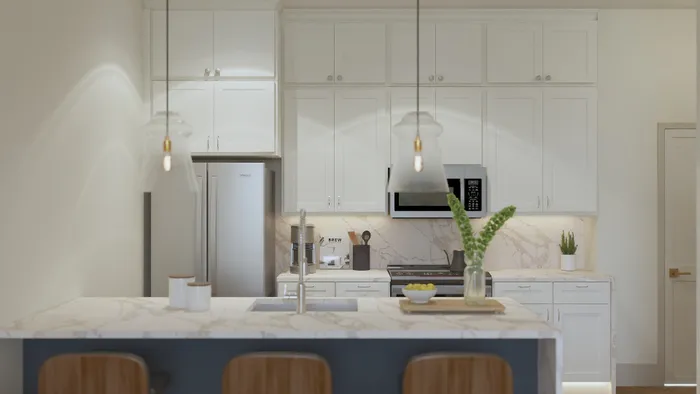 Modern kitchen with sleek white cabinetry, marble countertops, and stylish pendant lighting, creating an inviting and sophisticated cooking space.