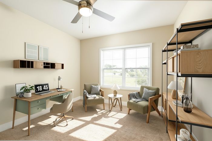 Bright home office with modern desk, stylish shelving, and cozy reading nook by a sunlit window.