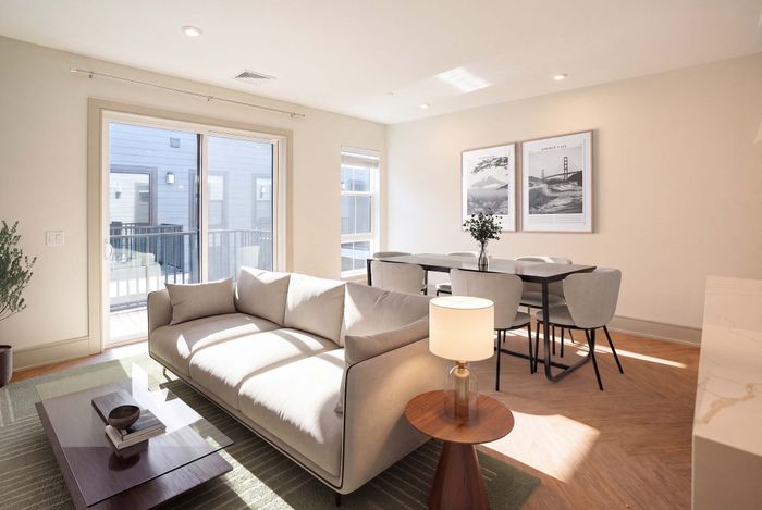 Bright and welcoming open-concept living and dining area with modern decor, neutral tones, and abundant natural light.