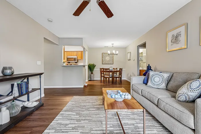 Inviting open-concept living space with cozy seating, elegant dining area, and modern kitchen.