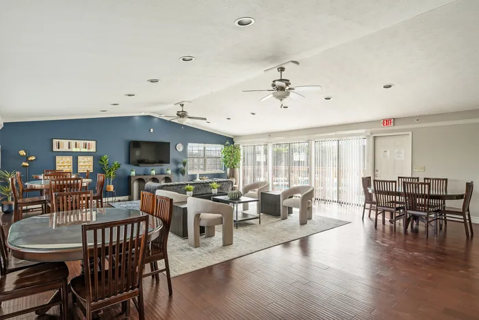 Elegant communal space featuring stylish seating, modern dining tables, and abundant natural light, perfect for gatherings and relaxation.
