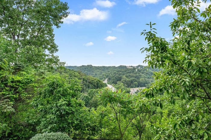 Breathtaking view of lush green hills under a bright blue sky, perfect for nature lovers seeking tranquility and beauty.