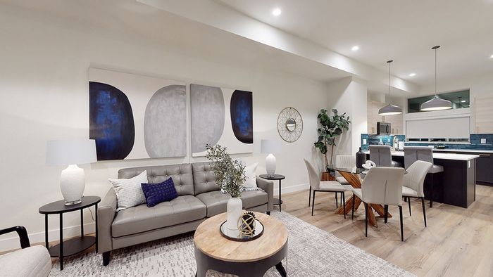 Large living room with dining room open to kitchen with modern finishes