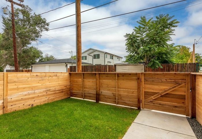 Private back yard with wood fence