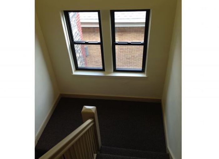 Centro Apartments Staircase - Schulhof Property Management LLC