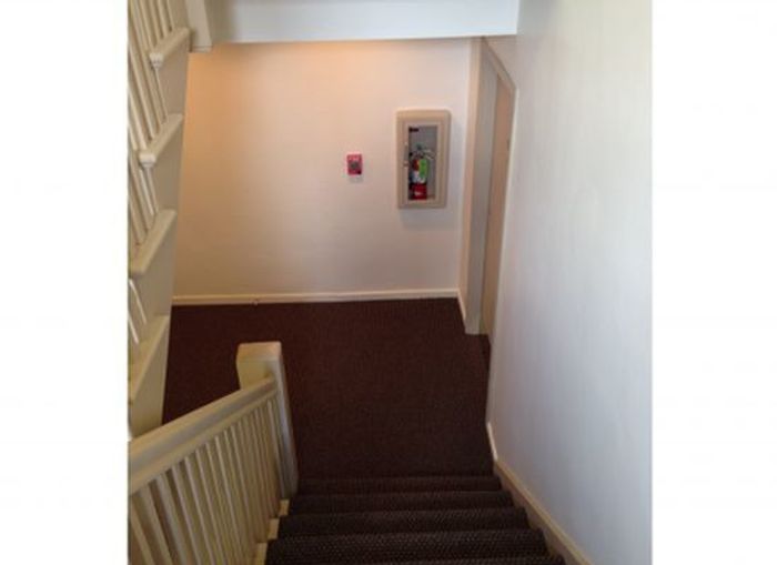 Centro Apartments Staircase - Schulhof Property Management LLC